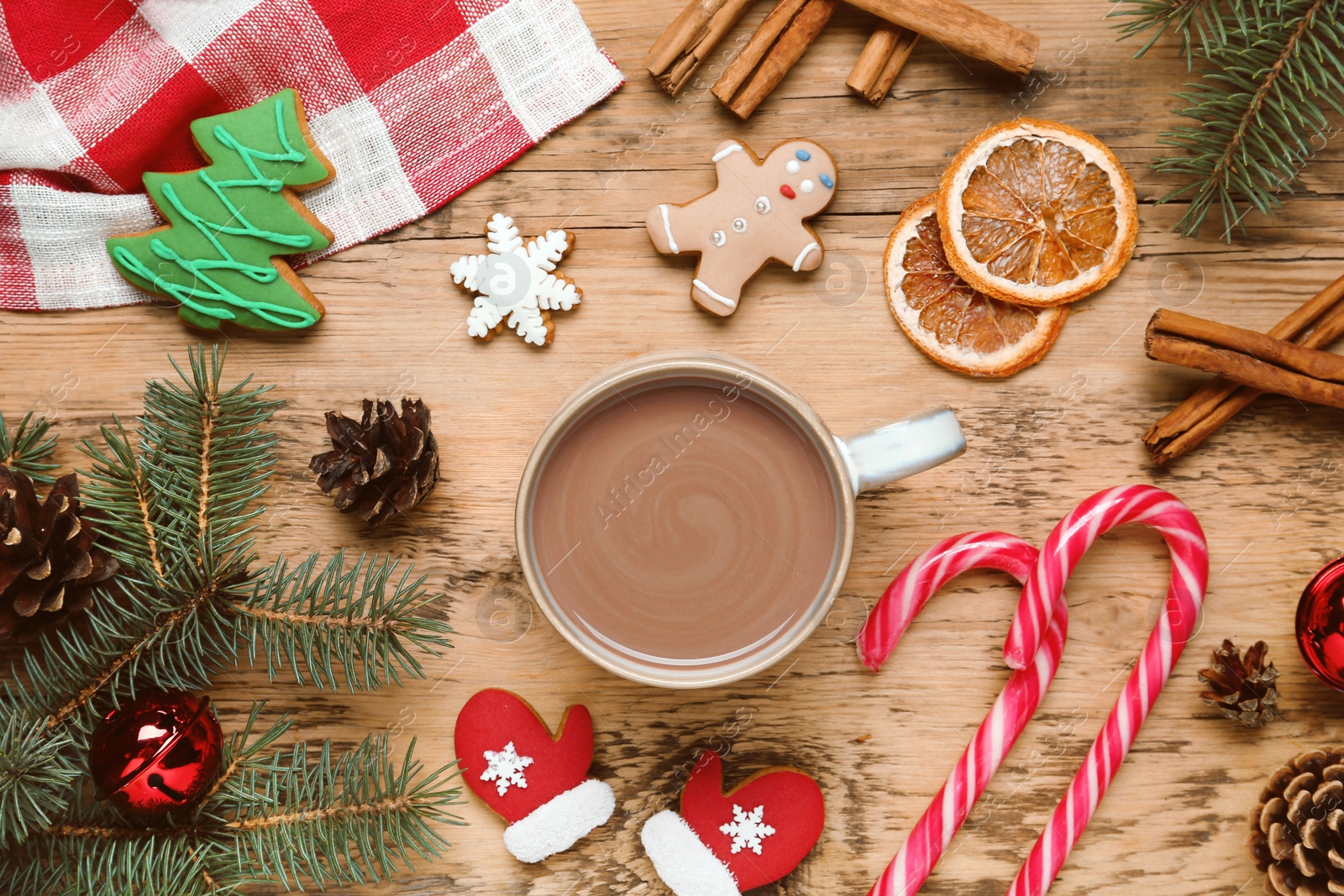 Photo of Flat lay composition with delicious hot chocolate and Christmas decor on wooden table