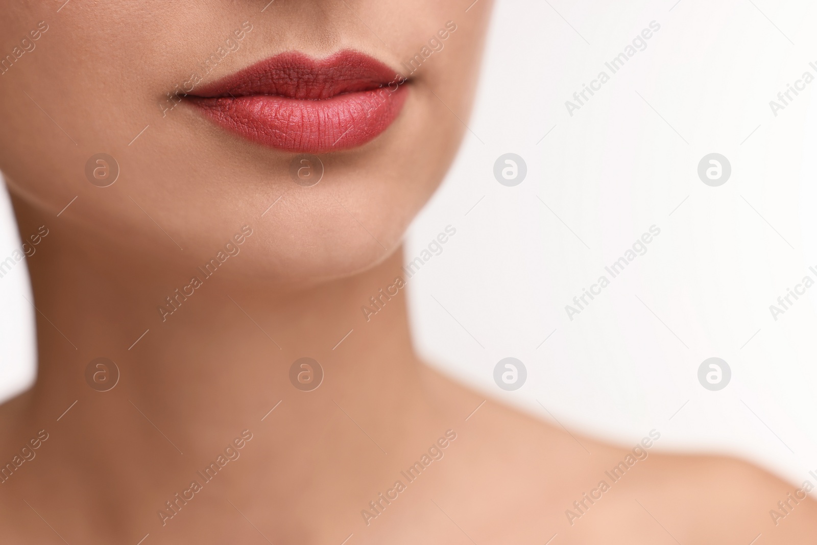 Photo of Woman with beautiful lips on white background, closeup. Space for text