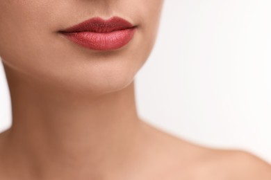 Photo of Woman with beautiful lips on white background, closeup. Space for text