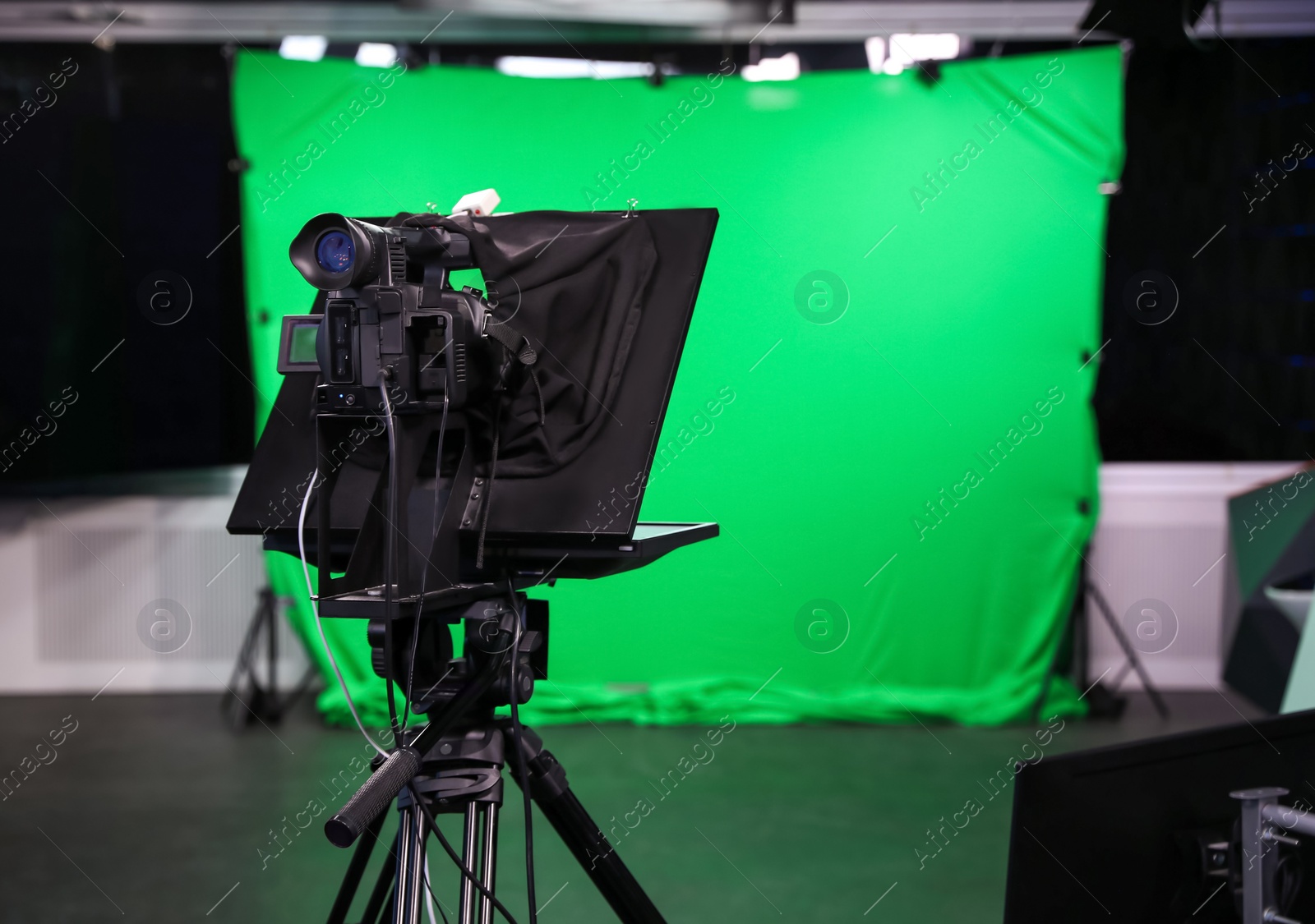 Photo of Modern video recording studio with professional equipment, focus on camera