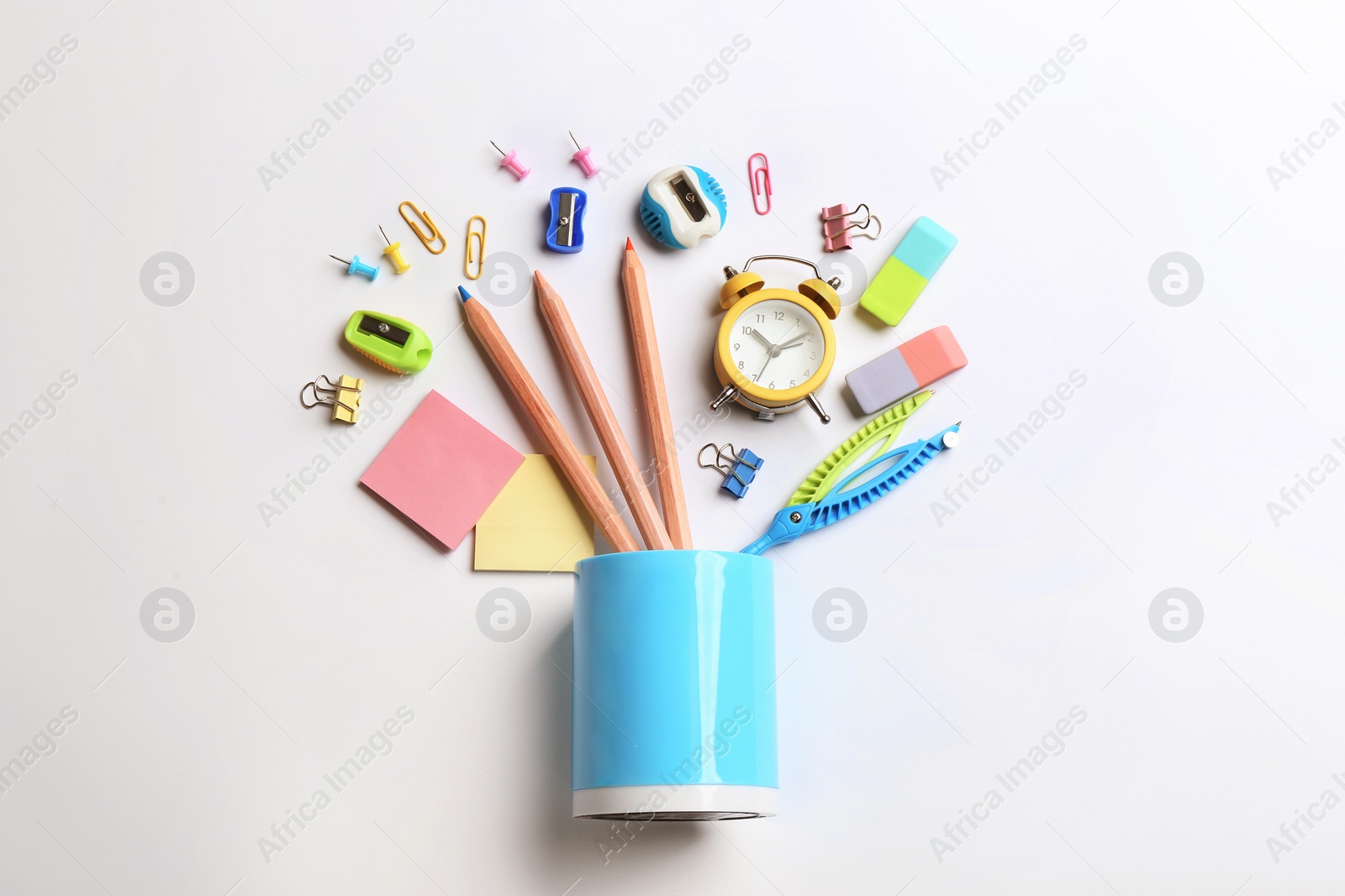 Photo of Flat lay composition with school stationery on white background. Back to school