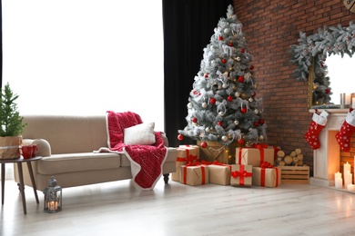 Stylish room interior with beautiful Christmas tree