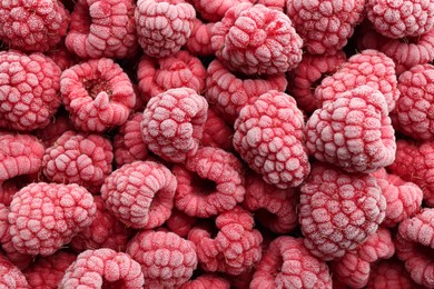 Photo of Tasty frozen raspberries as background, top view