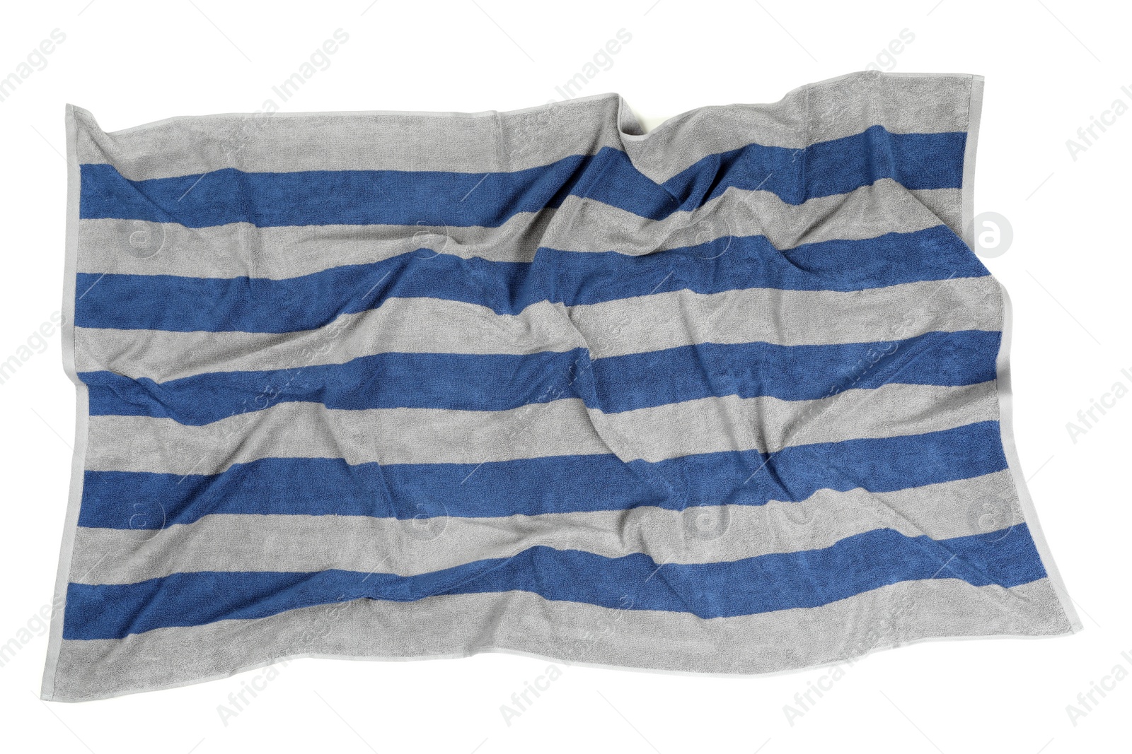 Photo of Crumpled striped beach towel isolated on white, top view