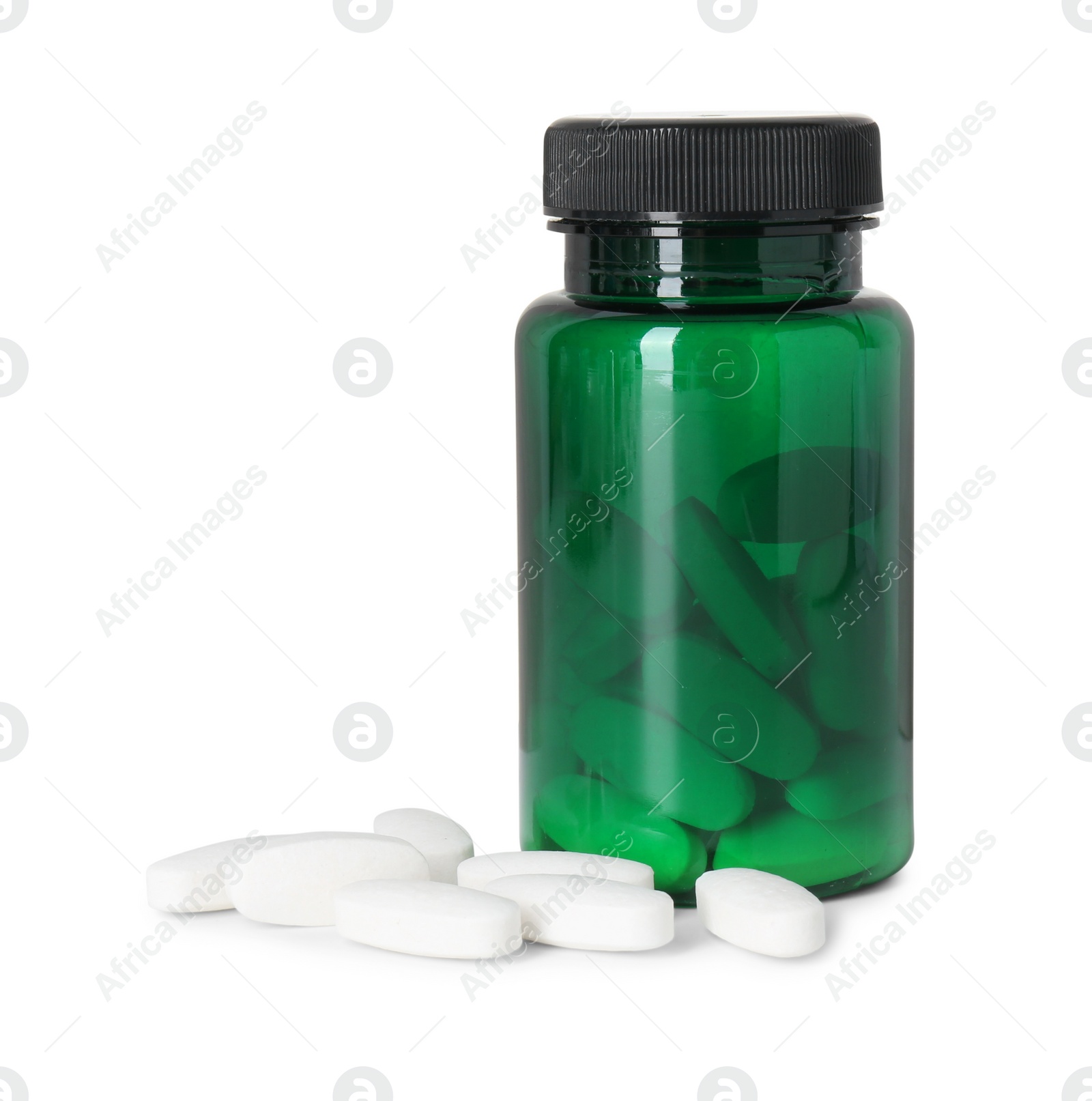 Photo of Bottle and pile of vitamin pills isolated on white