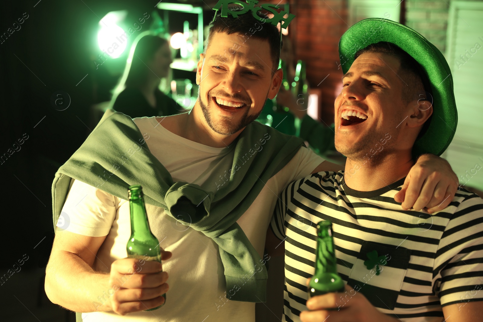 Photo of Men with beer celebrating St Patrick's day in pub