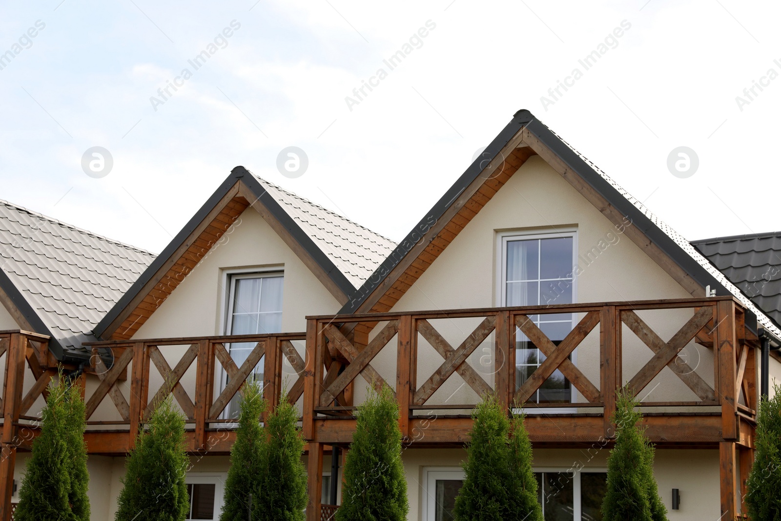 Photo of Exterior of beautiful modern house against cloudy sky