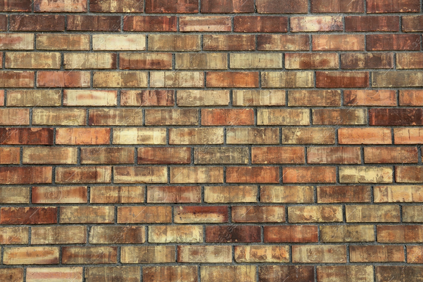 Photo of Texture of brown brick wall as background