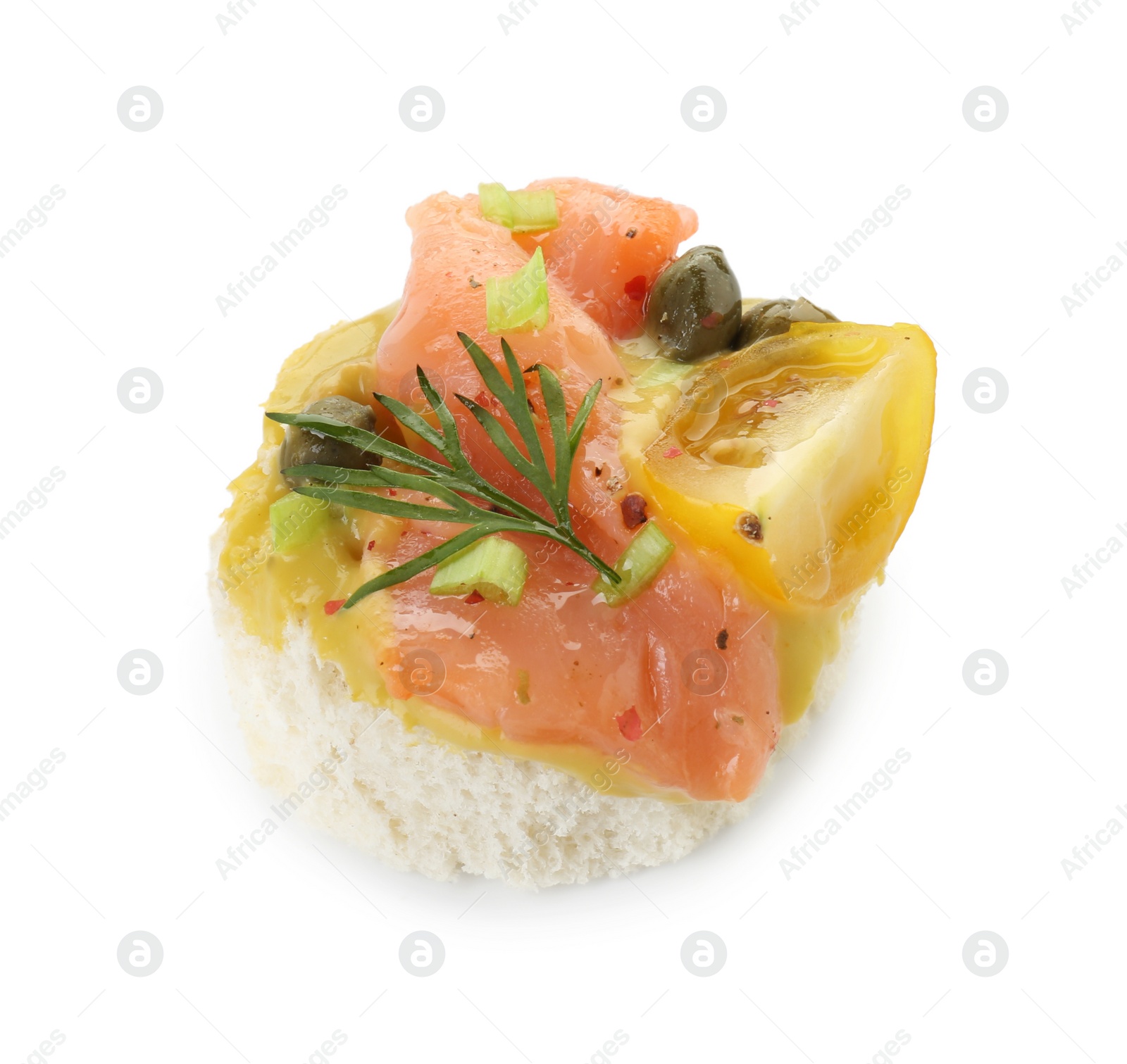 Photo of Tasty canape with salmon, tomatoes, capers and herbs isolated on white