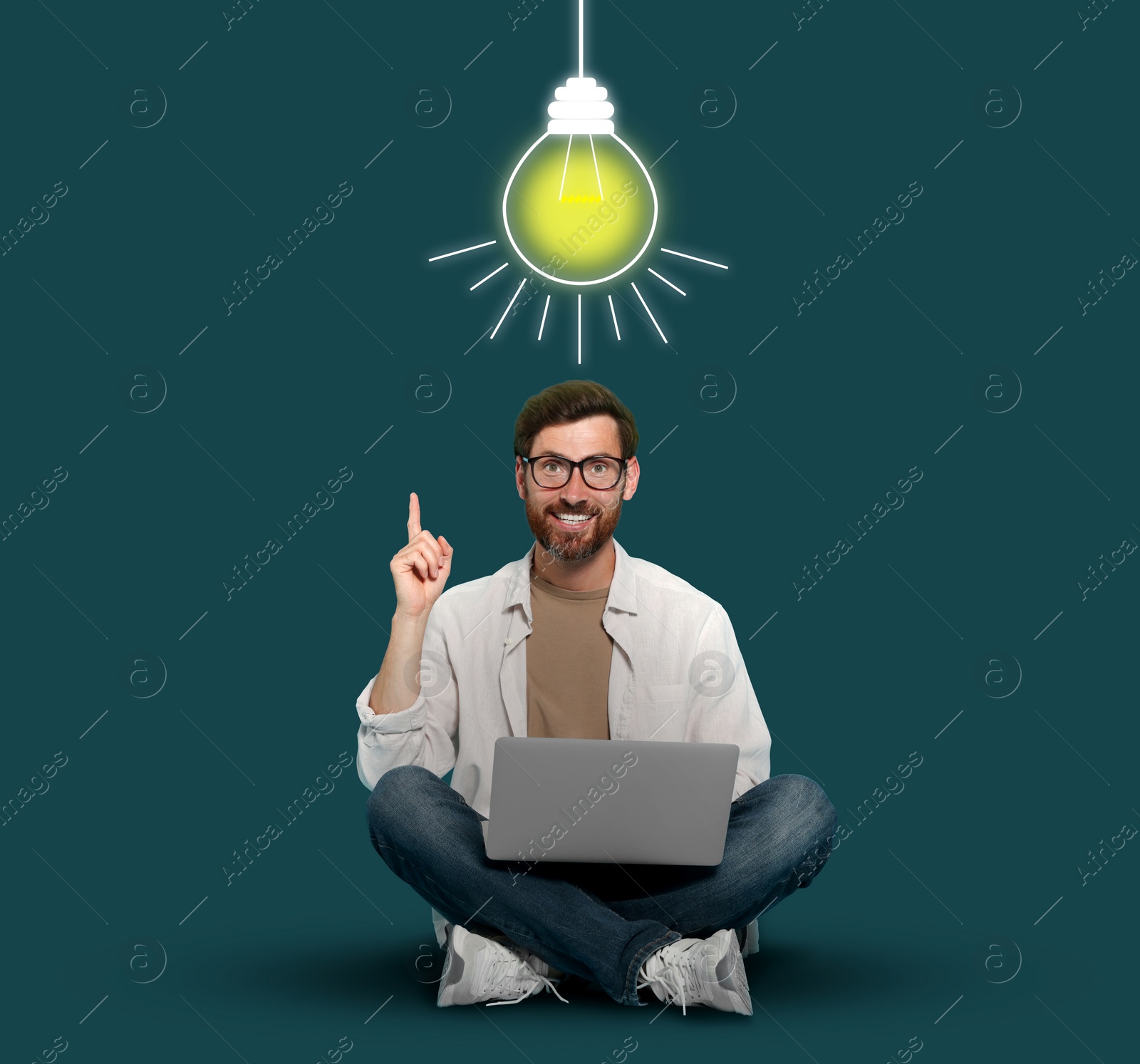 Image of Idea generation. Man with laptop on teal background. Illustration of glowing lamp light over him