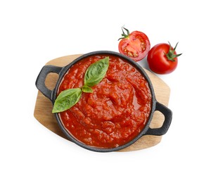 Homemade tomato sauce in bowl and fresh ingredients isolated on white, top view