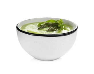 Photo of Delicious asparagus soup with arugula isolated on white