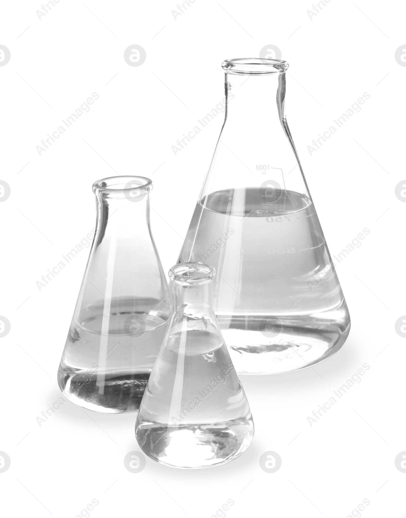 Photo of Flasks with liquid on white background. Laboratory analysis equipment