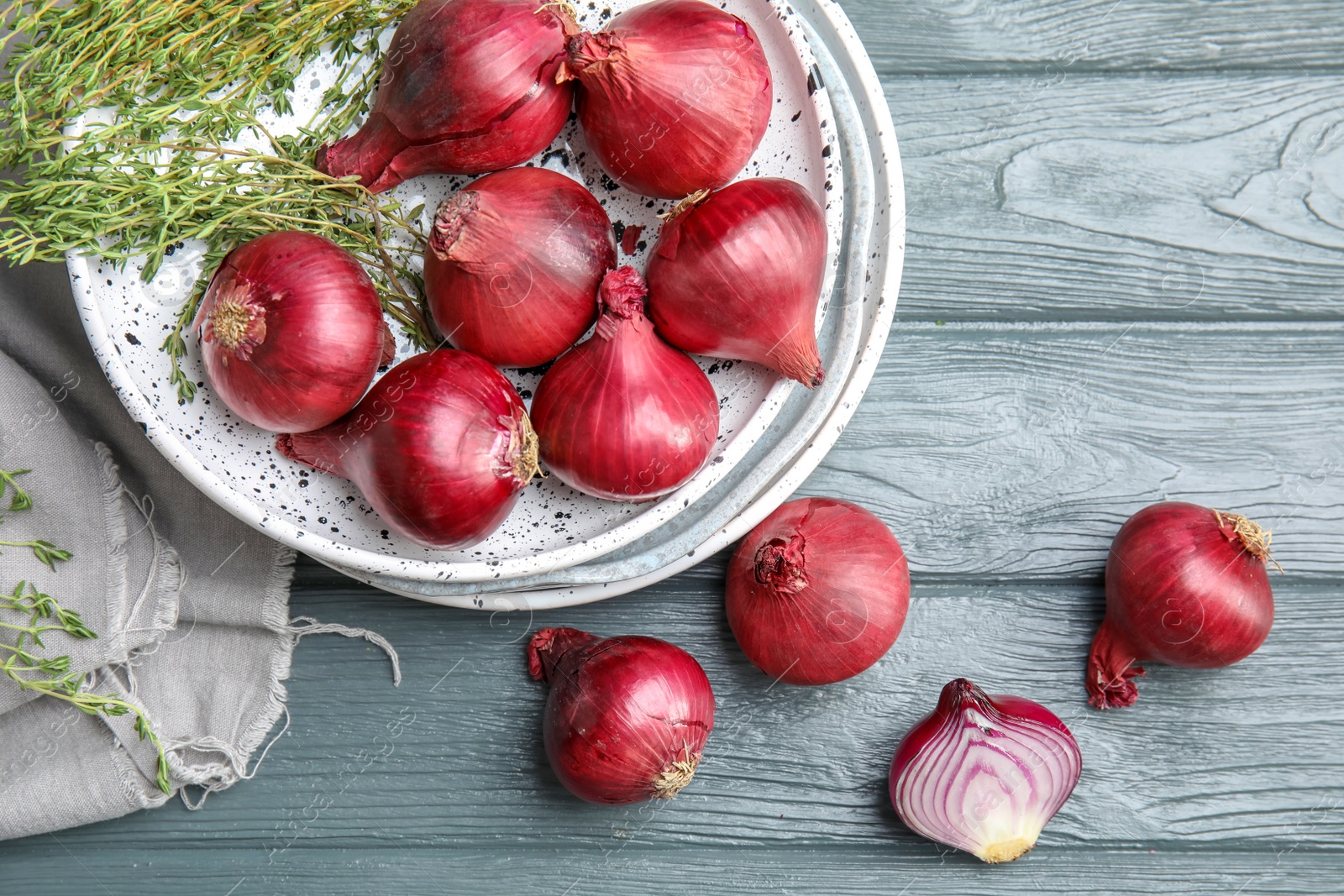 Photo of Flat lay composition with ripe red onions on wooden table