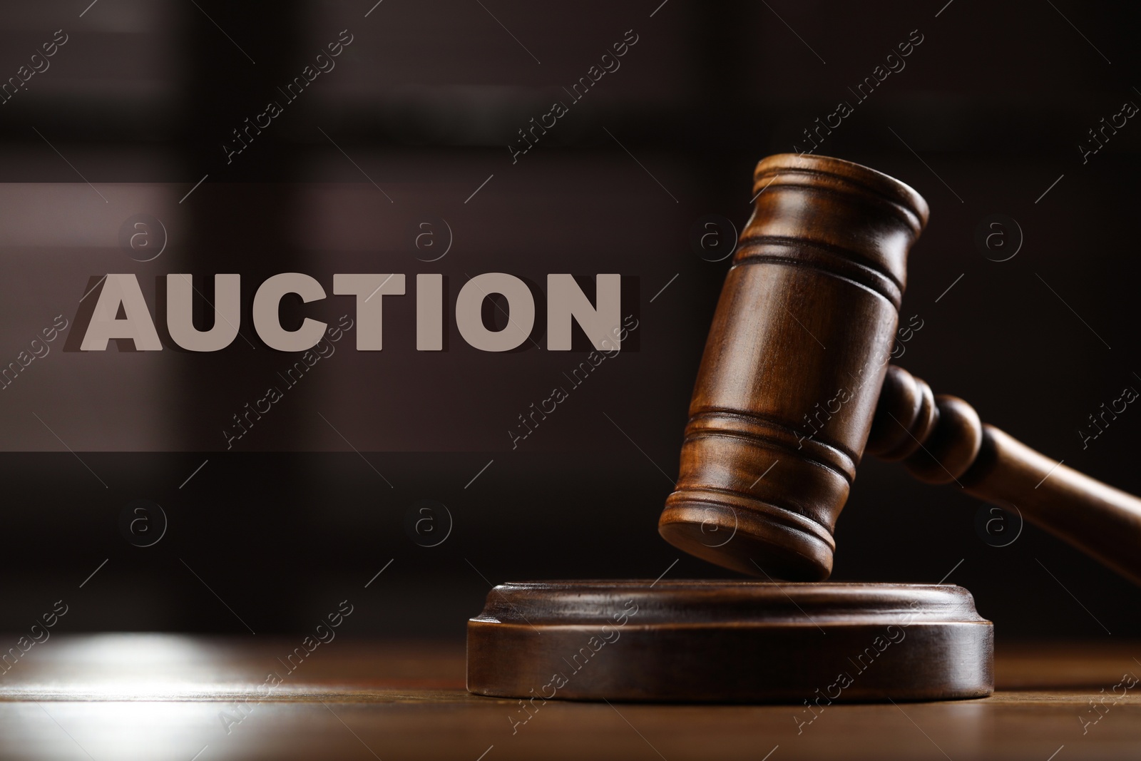 Image of Auction concept. Gavel on wooden table indoors