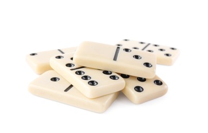 Pile of classic domino tiles on white background