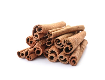 Photo of Aromatic cinnamon sticks on white background