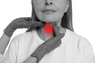 Endocrinologist examining thyroid gland of patient on white background, closeup. Color accent effect