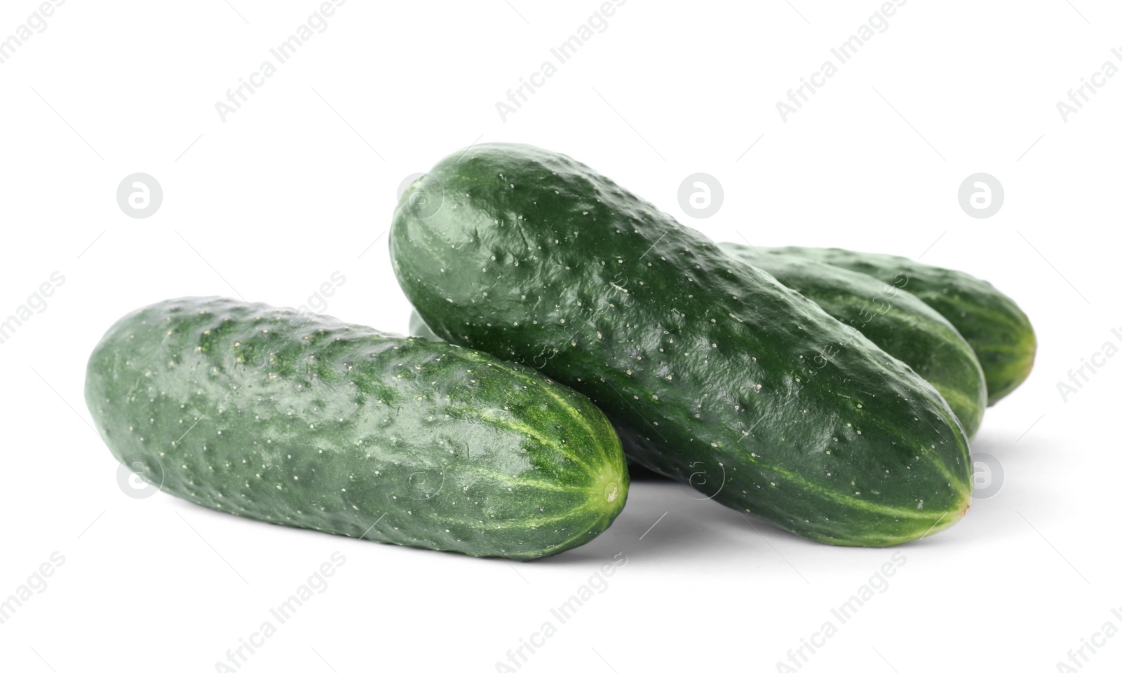 Photo of Fresh green cucumbers on white background