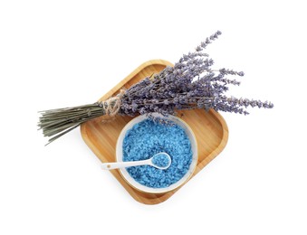 Photo of Bowl with blue sea salt and lavender flowers isolated on white, top view