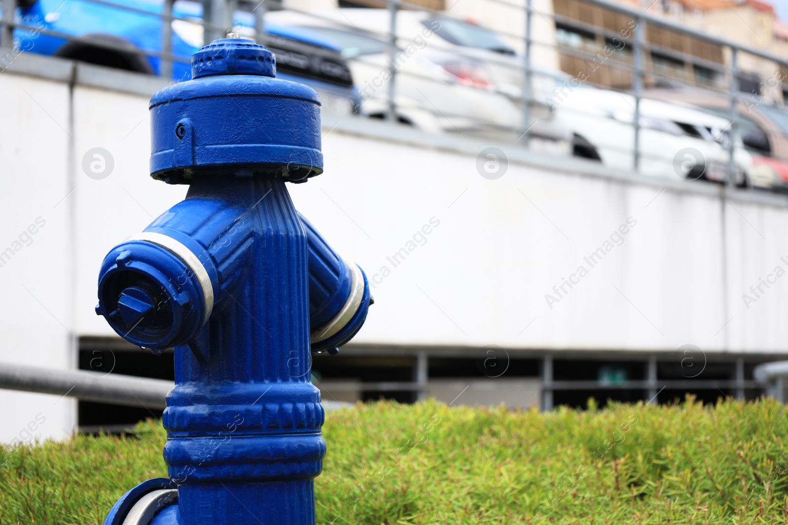 Photo of Blue metal fire hydrant on city street, closeup. Space for text