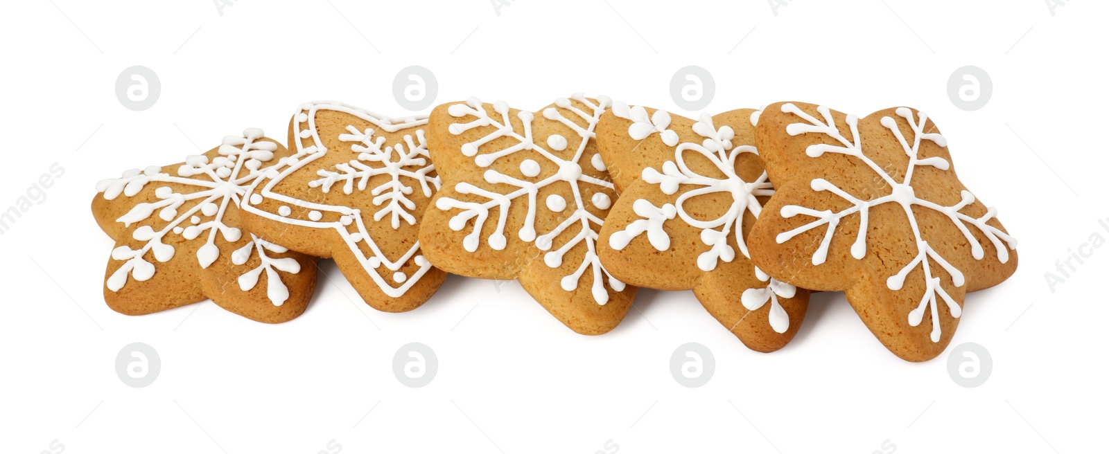 Photo of Tasty star shaped Christmas cookies with icing isolated on white