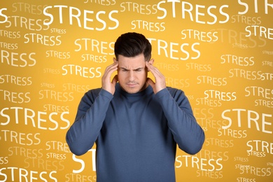 Image of Stressed young man and text on yellow background
