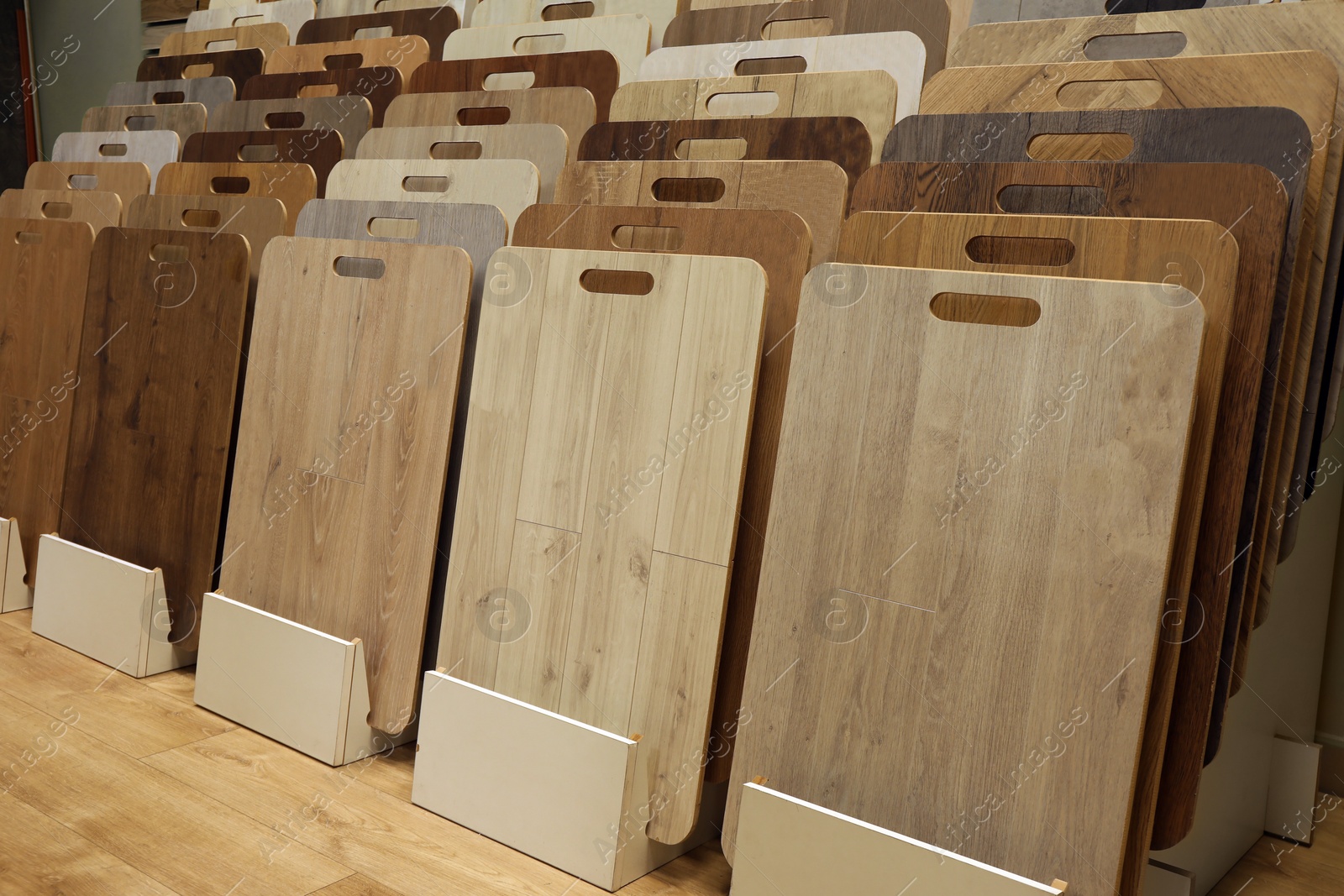 Photo of Many different samples of wooden flooring in store