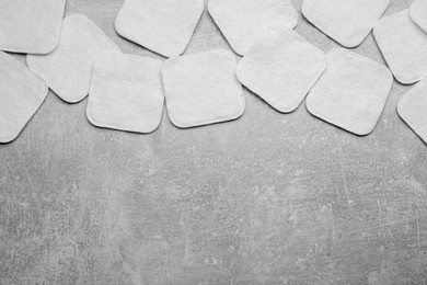 Photo of Many clean cotton pads on light grey background, flat lay. Space for text