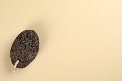 Photo of Pumice stone on beige background, top view. Space for text
