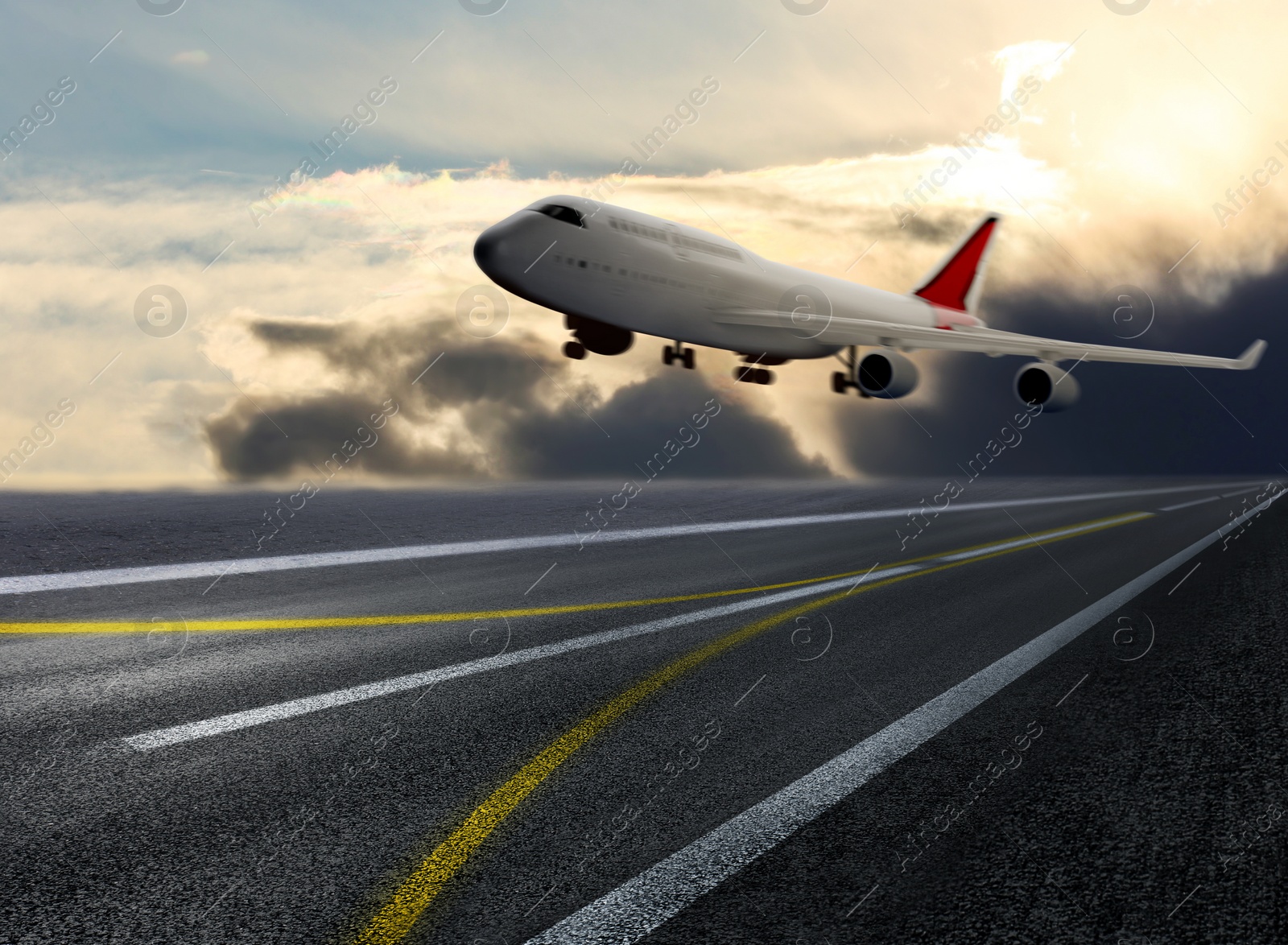 Image of Modern white airplane landing on runway 