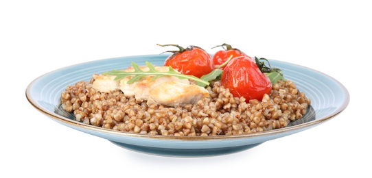 Delicious buckwheat porridge with meat and tomatoes on white background