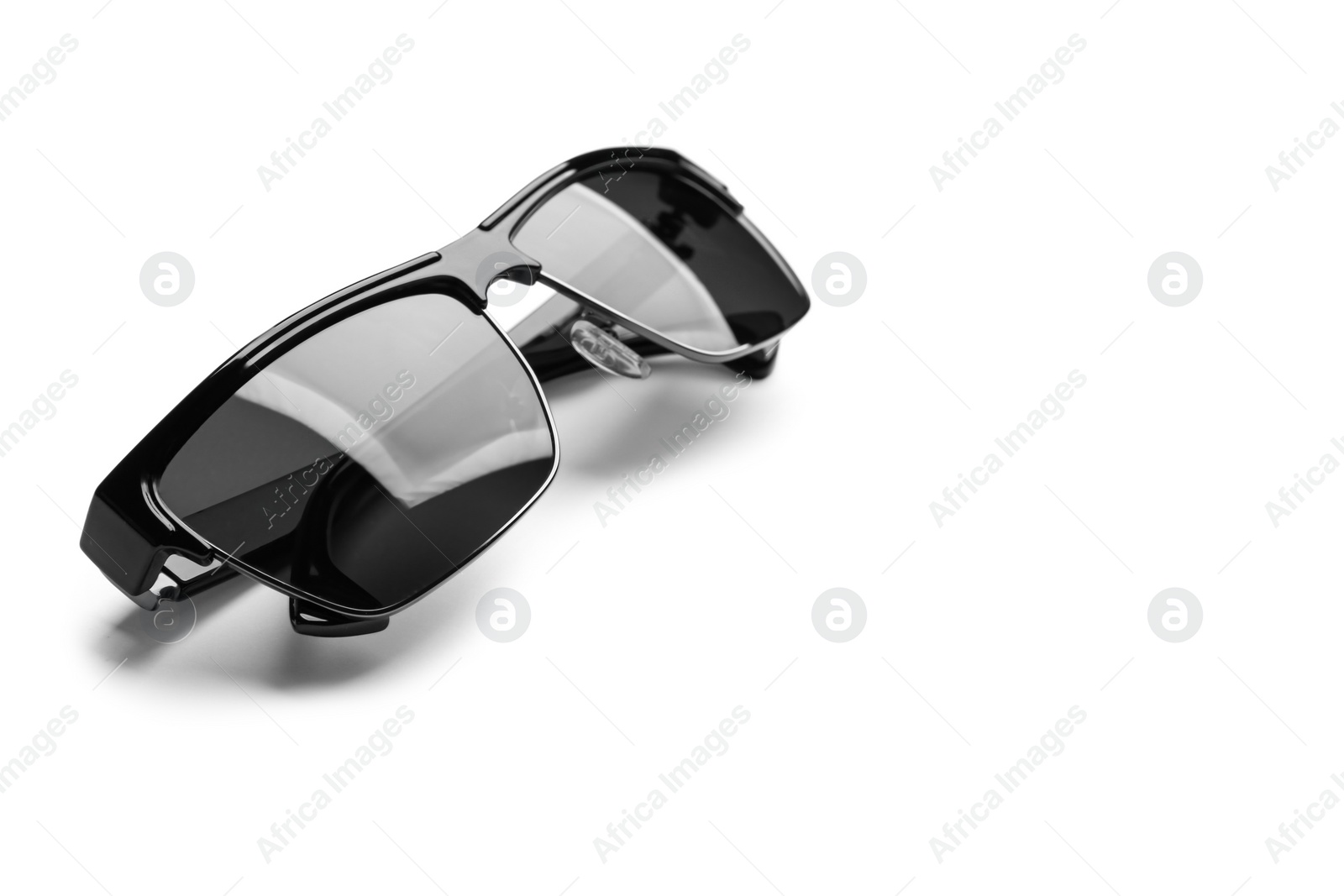 Photo of Stylish sunglasses on white background. Fashionable accessory