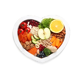 Photo of Heart shaped tray with healthy products on white background, top view