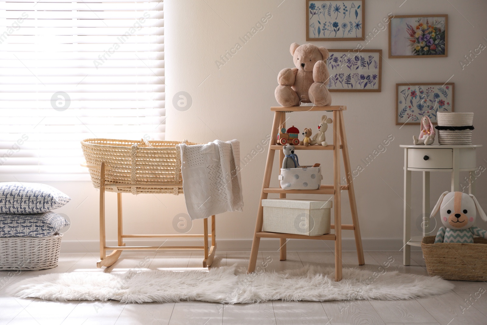 Photo of Decorative ladder with toys and different stuff in stylish baby room. Idea for interior design