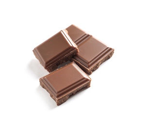 Photo of Pieces of tasty milk chocolate on white background