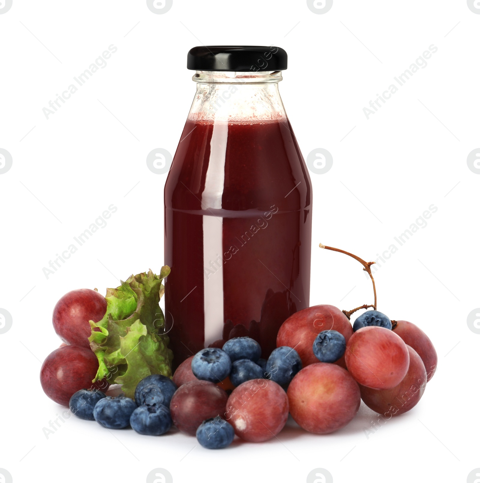 Photo of Bottle of delicious juice and fresh fruits on white background