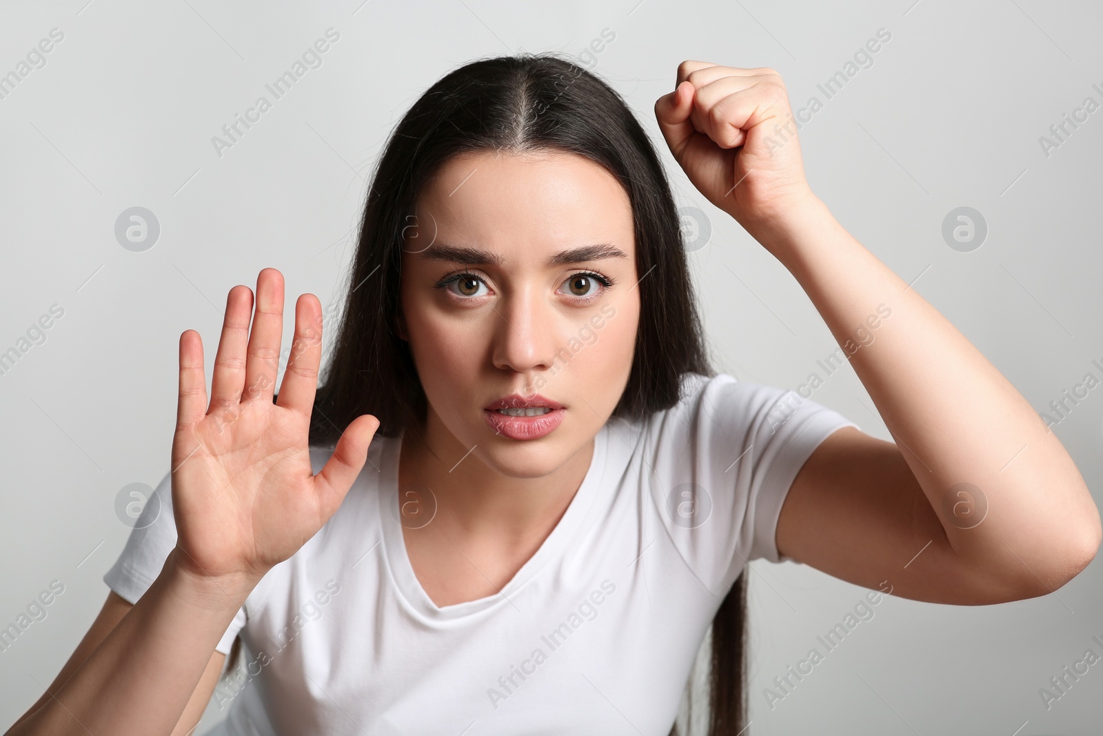 Photo of Young woman stuck to transparent screen. Internet addiction