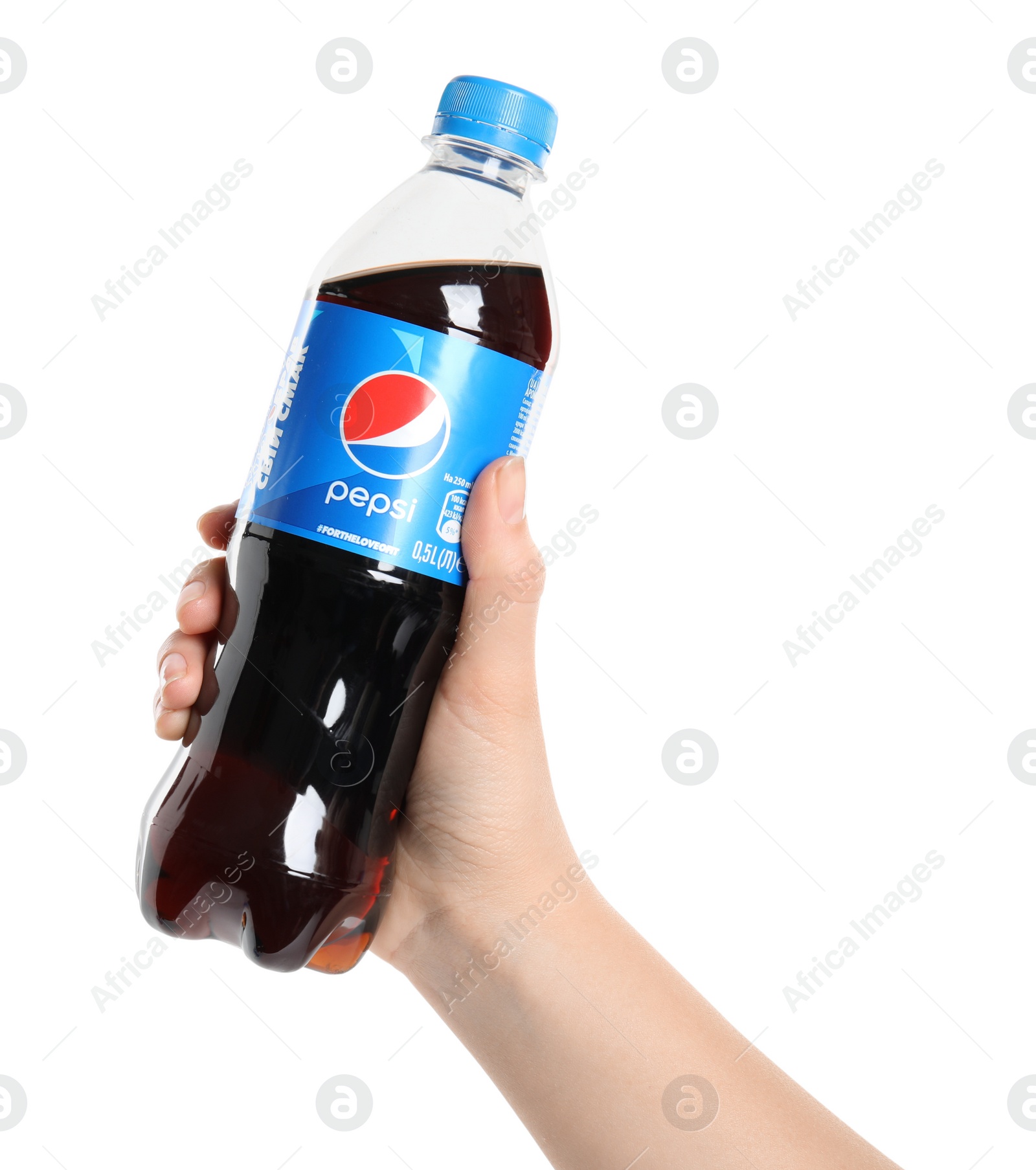 Photo of MYKOLAIV, UKRAINE - FEBRUARY 10, 2021: Woman holding bottle of Pepsi on white background, closeup