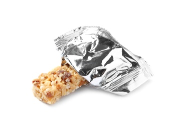 Photo of Grain cereal bar in foil on white background