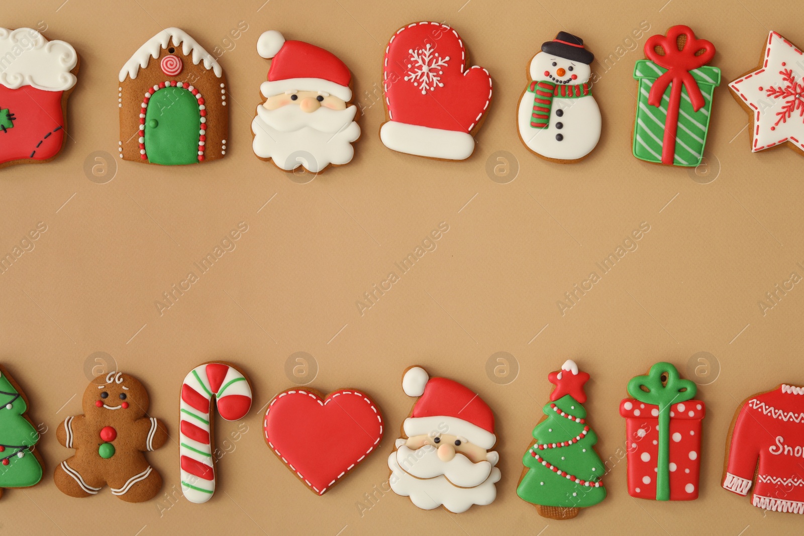 Photo of Different Christmas gingerbread cookies on brown background, flat lay. Space for text