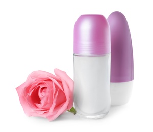 Photo of Natural female roll-on deodorants with rose on white background. Skin care