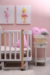 Baby room interior with beautiful pictures on wall