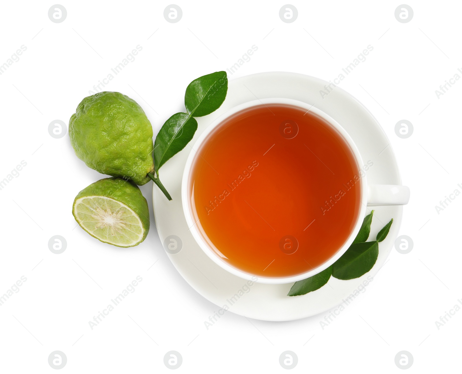 Photo of Cup of tasty bergamot tea and fresh fruits on white background, top view