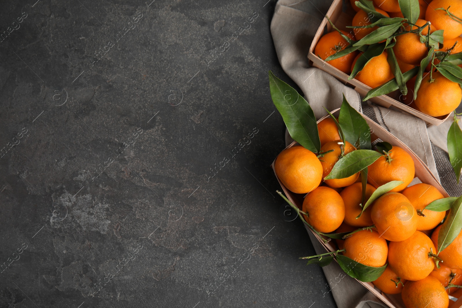 Photo of Flat lay composition with fresh ripe tangerines and space for text on grey background