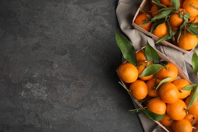 Photo of Flat lay composition with fresh ripe tangerines and space for text on grey background