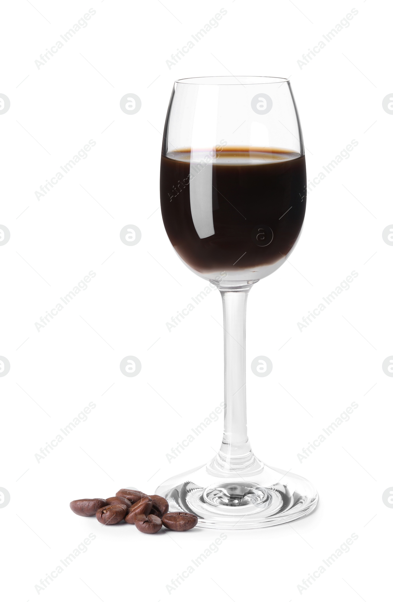 Photo of Shot glass with coffee liqueur and beans isolated on white