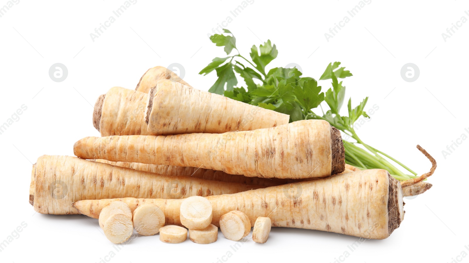 Photo of Raw parsley roots and bunch of fresh herb isolated on white