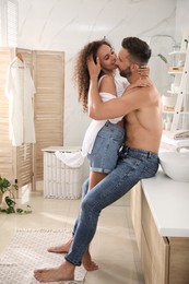 Lovely couple enjoying each other in bathroom at home