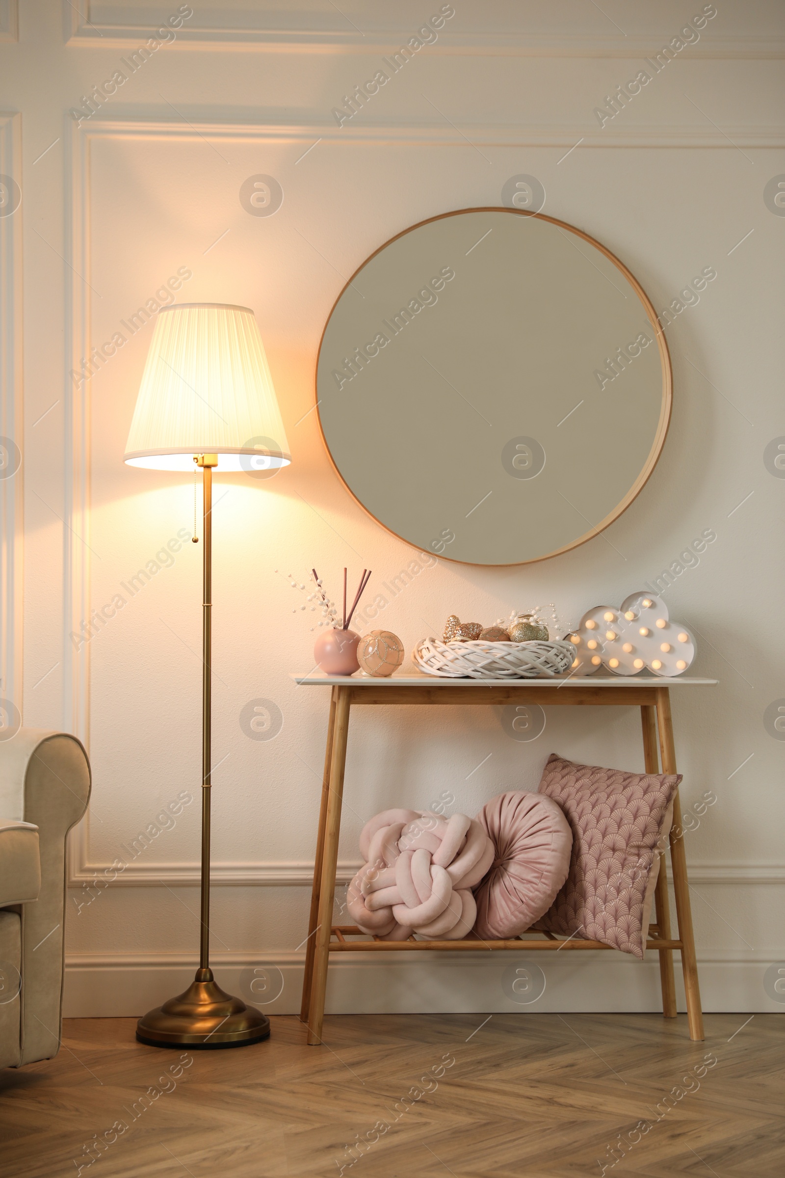 Photo of Beautiful room interior with round mirror and Christmas decor